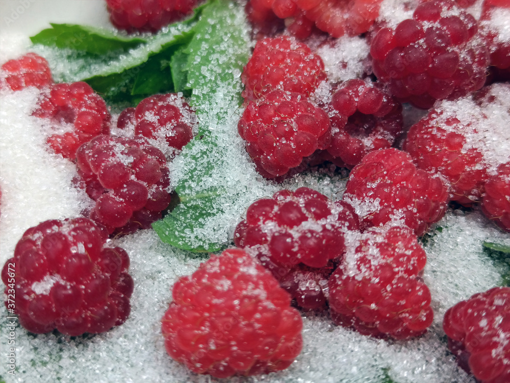photo of raspberries and mint leaves with white sugar. ingredients for mojito. Top view