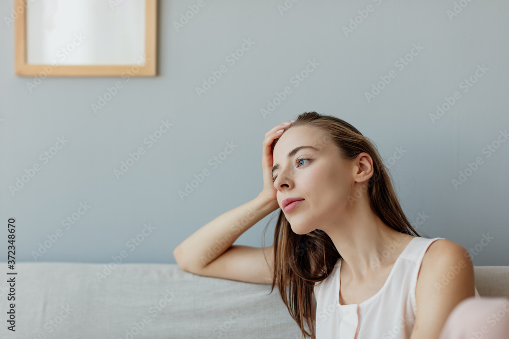 Portrait of young woman tired, resting near to window, Minsk, Belarus. Portrait of young woman tired, resting near to window, Minsk, Belarus.