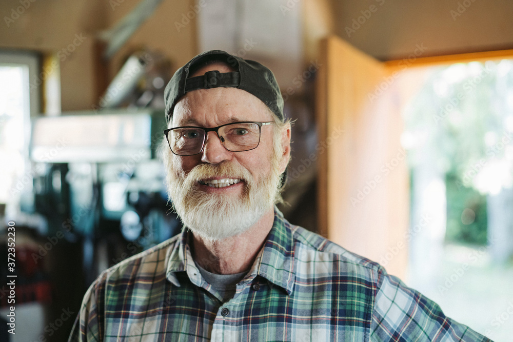 Portrait of older blacksmith looking at camera Portrait of older blacksmith looking at camera