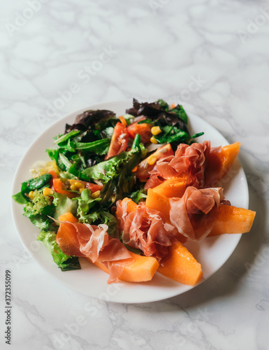 Prosciutto and Melon with mixed Salad photo