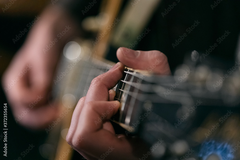 Musician: Man Strumming On Guitar Musician: Man Strumming On Guitar