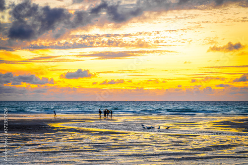 Gull rocks at sunset in Hollywell Bay in Cornwall photo