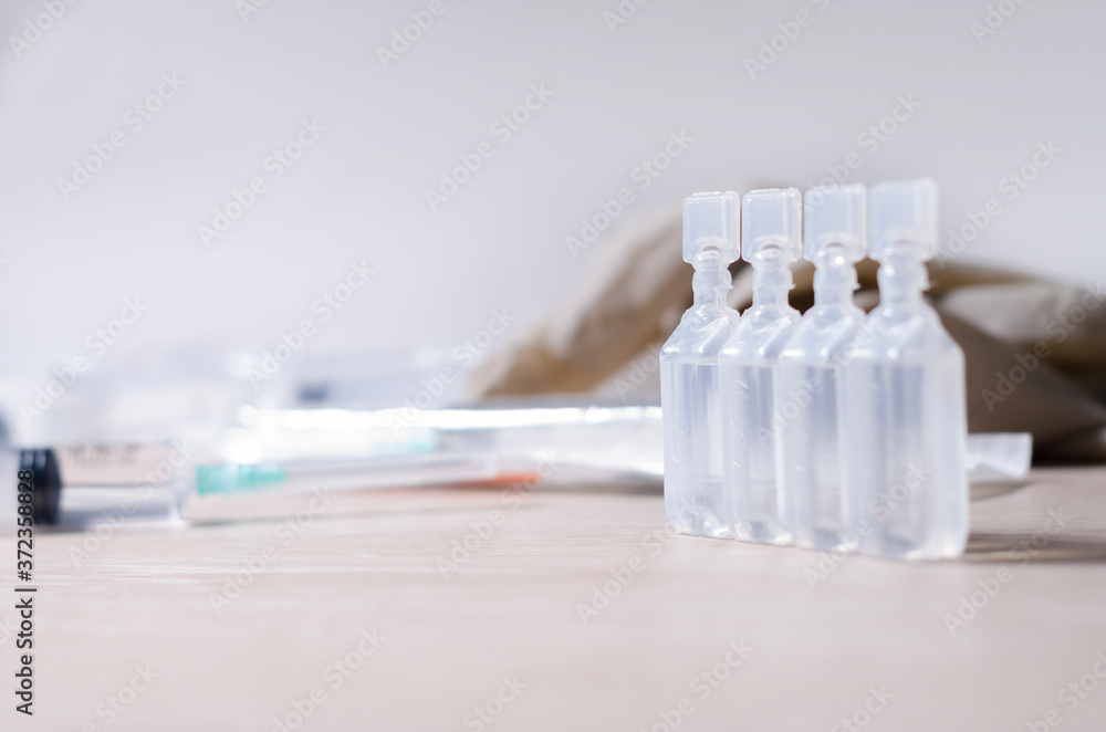 Injection of vaccines and syringes. It is used for the prevention, immunization and treatment of coronavirus infection, doctor uses syringe (new coronavirus disease 2019, COVID-19, Wuhan nCoV 2019). Injection of vaccines and syringes. It is used for the prevention, immunization and treatment of coronavirus infection, doctor uses syringe (new coronavirus disease 2019, COVID-19, Wuhan nCoV 2019).