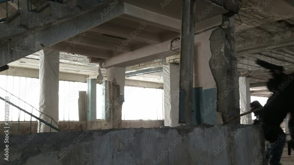 Special police force enters dilapidated building. Special police force enters dilapidated building.