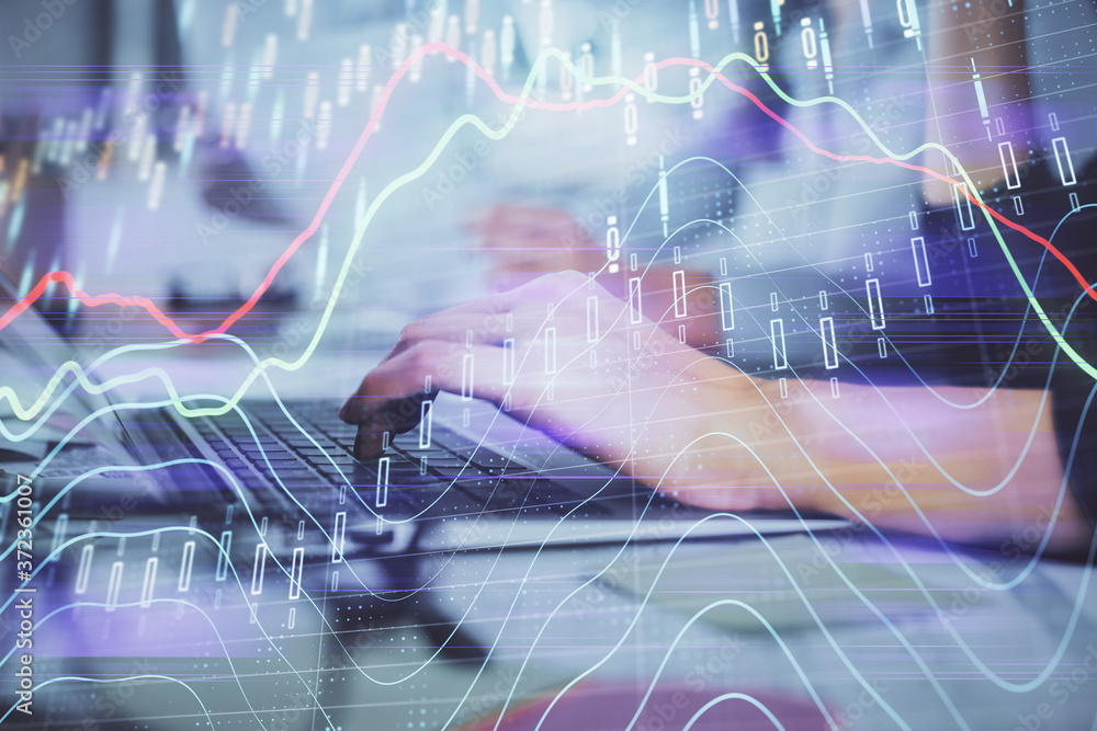 Naklejka premium Multi exposure of woman hands typing on computer and financial graph hologram drawing. Stock market analysis concept.