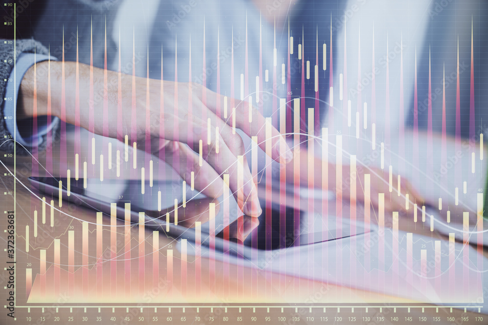 Double exposure of forex graph drawing and man and woman working together holding and using a mobile device. Trade concept. Double exposure of forex graph drawing and man and woman working together holding and using a mobile device. Trade concept.