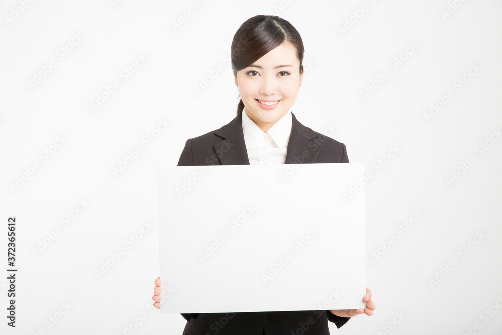 メッセージボードを持つ女性新入社員 メッセージボードを持つ女性新入社員