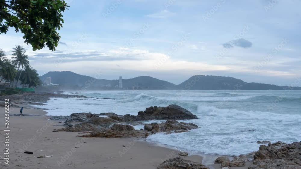Long speed shutter Time Lapse of big wave crashing on rocks in Patong bay Phuket Thailand Long speed shutter Time Lapse of big wave crashing on rocks in Patong bay Phuket Thailand