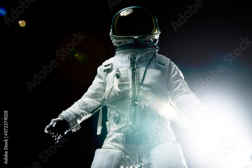 astronaut with lens flares and black background