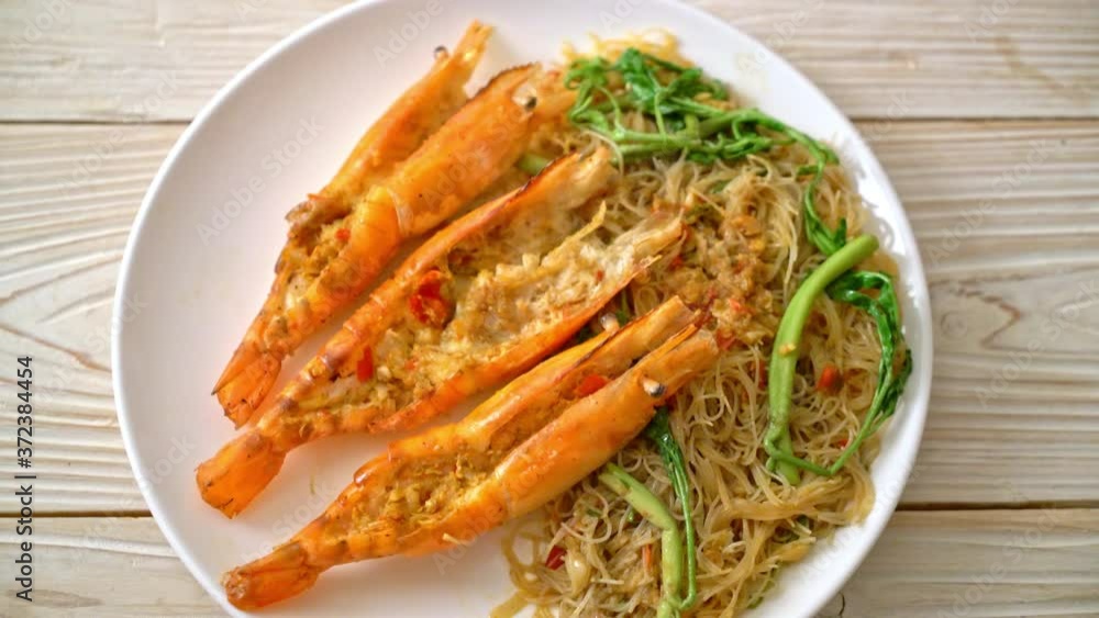 Stir-fried rice vermicelli and water mimosa with river prawns Stir-fried rice vermicelli and water mimosa with river prawns