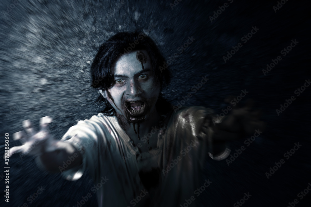 Scary zombie with blood and wound on his body standing Scary zombie with blood and wound on his body standing