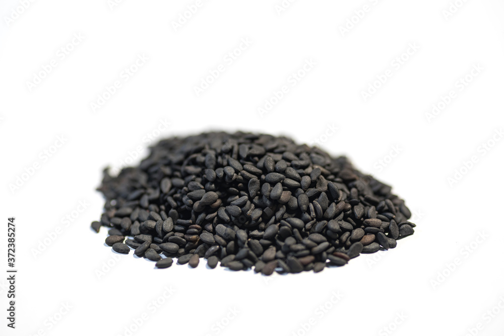 black sesame seeds on white background
black sesame seeds on white background