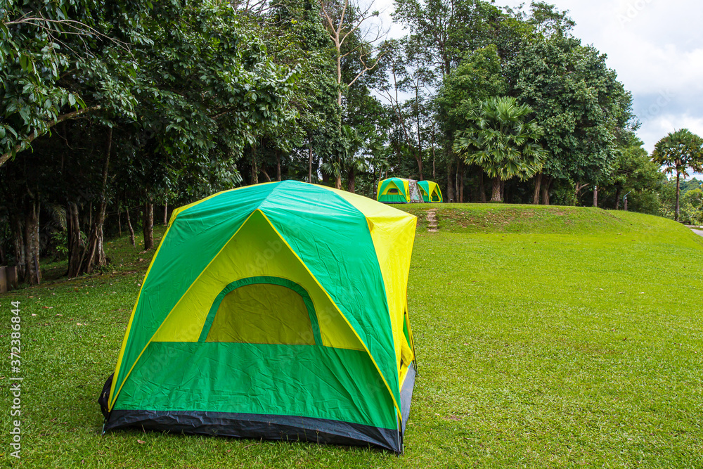 adventure outdoor tent in forest  background for holiday vacation advertising concept.