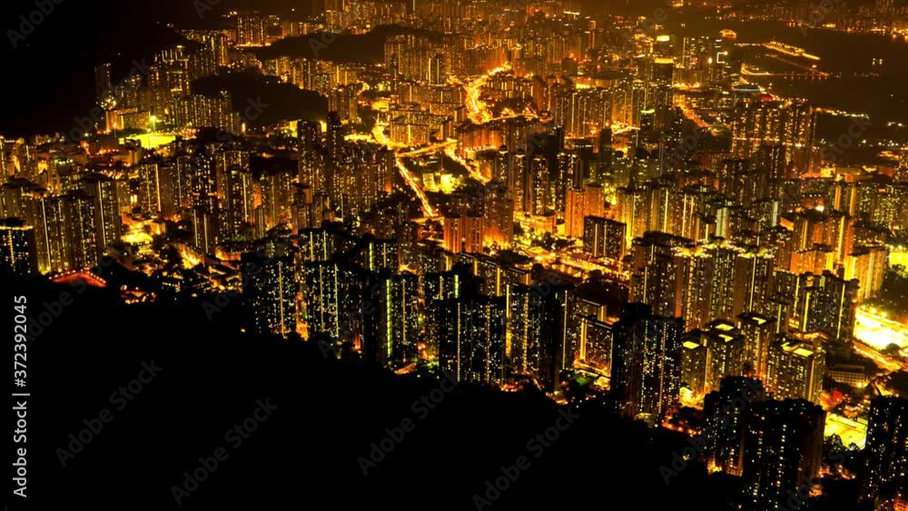 Hong Kong night aerial view of dense populated area of Kowloon. 4K resolution time lapse. Hong Kong night aerial view of dense populated area of Kowloon. 4K resolution time lapse.