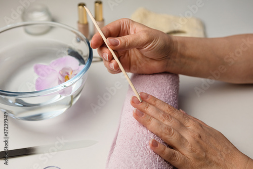 Hands of an adult woman 50+ close-up. Concept of Spa treatments and manicures, natural beauty.