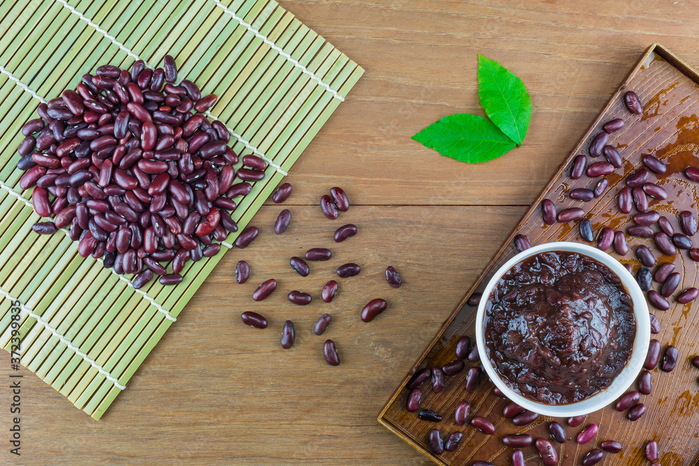 Red beans ground on the wooden floor. Red beans ground on the wooden floor.