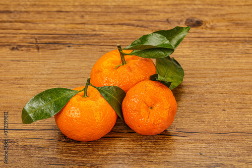 Ripe sweet tasty tangerine with leaves