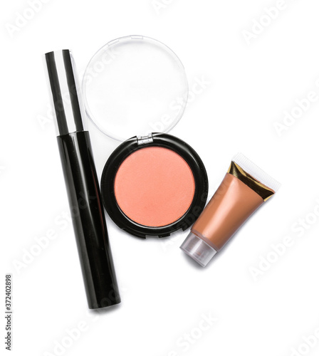 Different makeup cosmetics on white background