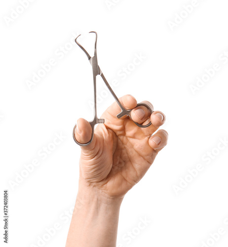 Male hand with surgeon's tool on white background