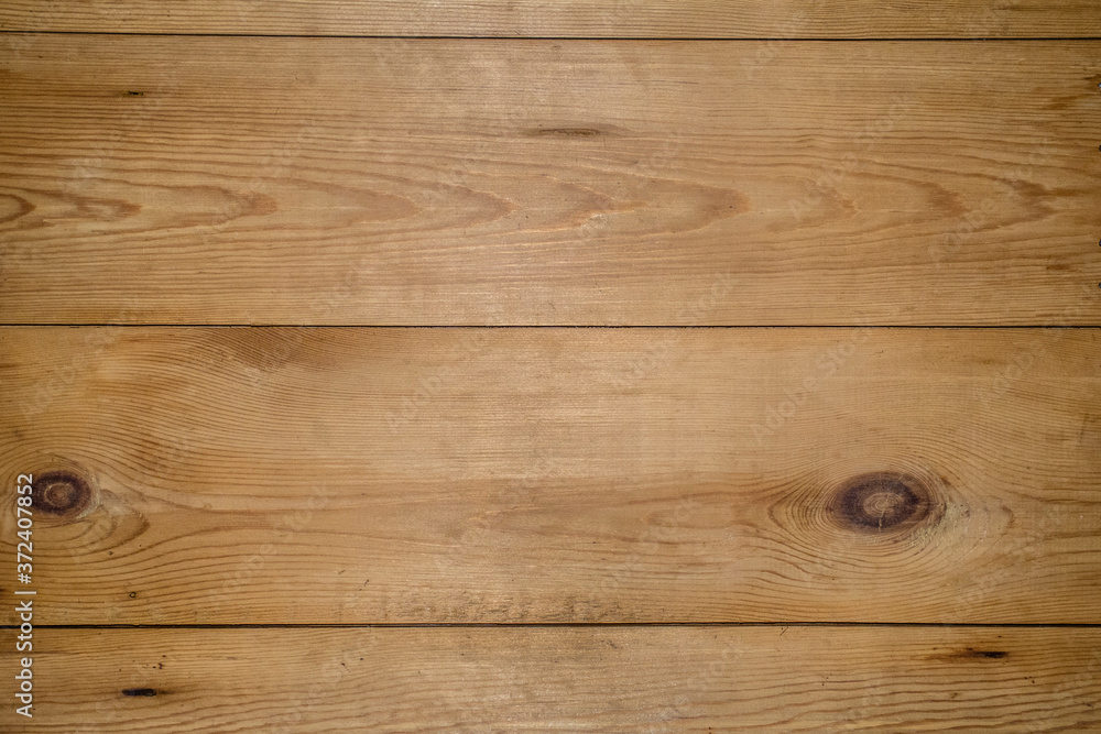 Texture of old pine boards arranged horizontally as a background. Texture of old pine boards arranged horizontally as a background.