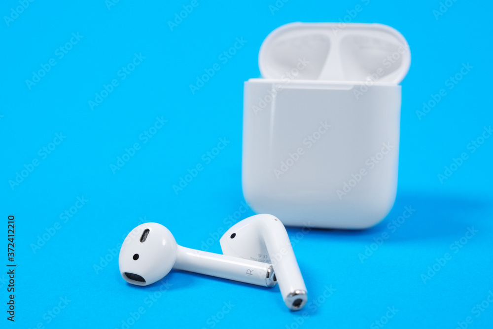 Rostov, Russia - July 06, 2020: Apple AirPods wireless Bluetooth headphones  and charging case for Apple iPhone. New Apple Earpods Airpods in box Stock  Photo | Adobe Stock
