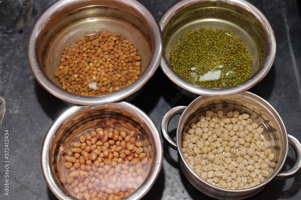 Fresh green gram beans and peanuts with channa dal on black background Fresh green gram beans and peanuts with channa dal on black background