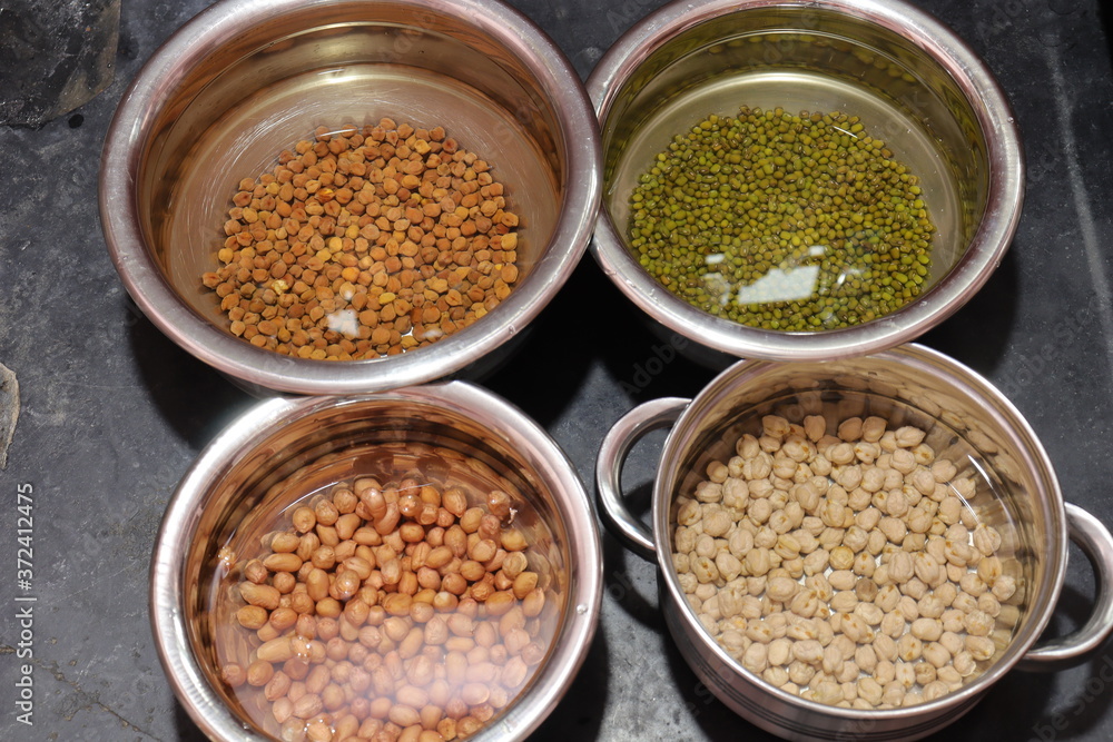 Fresh green gram beans and peanuts with channa dal on black background Fresh green gram beans and peanuts with channa dal on black background