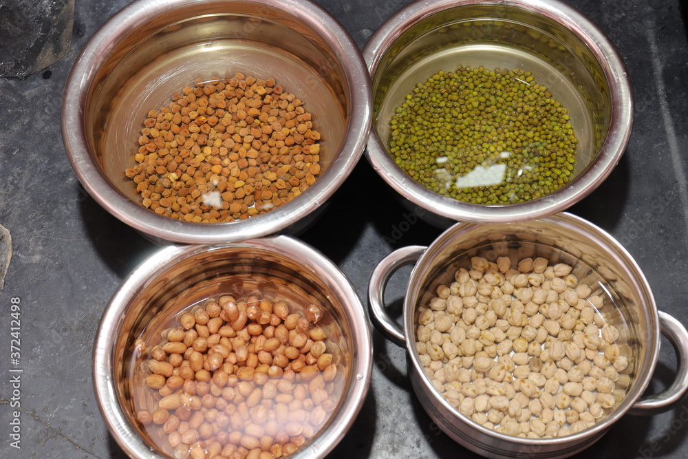 Fresh green gram beans and peanuts with channa dal on black background Fresh green gram beans and peanuts with channa dal on black background