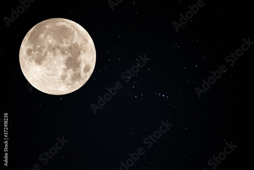 Full moon on the sky with real stars.