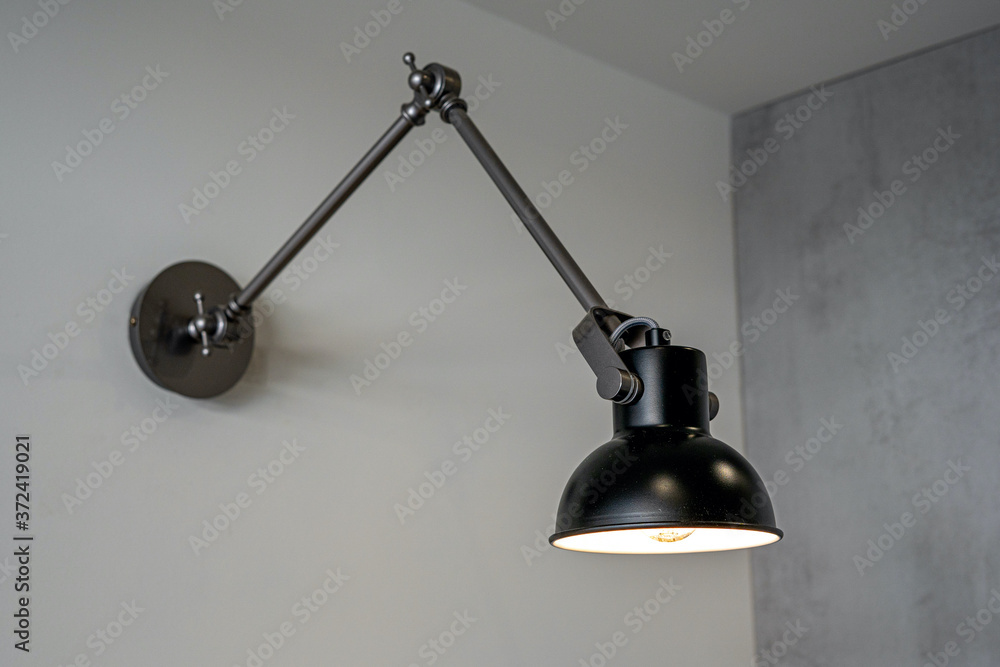 The modern lamp on a wall. Illuminate on the wall background. High quality photo The modern lamp on a wall. Illuminate on the wall background. High quality photo