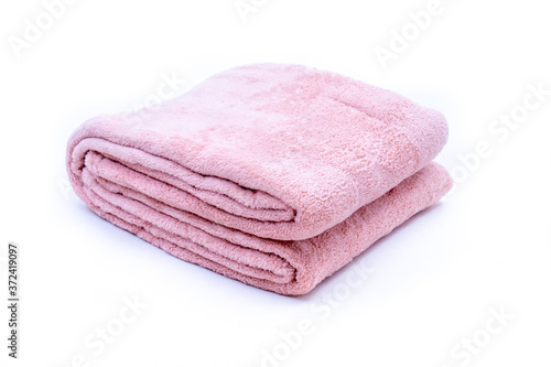 Folded red coral fleece throw isolated on white background