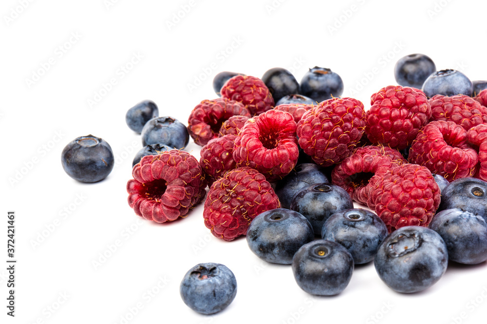 raspberries and blueberries isolated on white background raspberries and blueberries isolated on white background