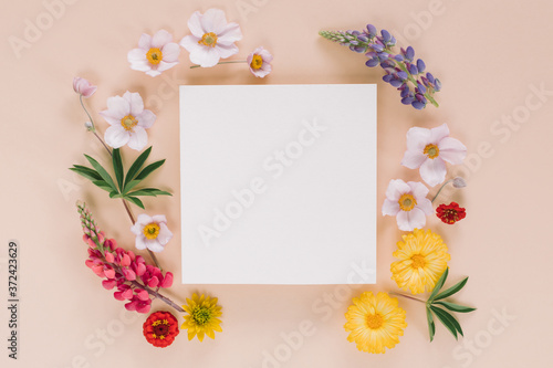 Fototapeta Naklejka Na Ścianę i Meble -  Elegant floral composition with paper blank in the centre. Branding mock up concept.