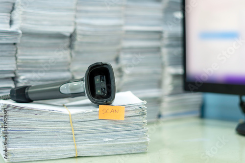 Documents waiting to read by barcode reader for convert data into the computer.