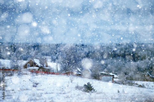Russian village in winter, landscape in January snowfall, village houses