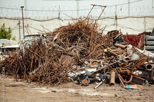 Pile of rusty scrap metal in a landfill.