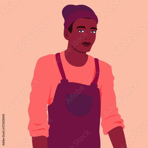 Portrait of a young man in a work apron
