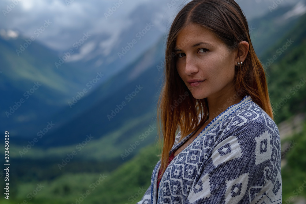 Stylish female hipster walking on top of mountains. Stylish female hipster walking on top of mountains.
