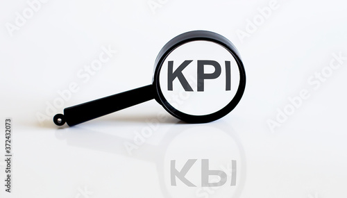 Magnifier with text KPI on the white background