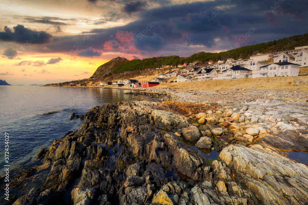 Beautiful landscape of rocky coastline in Norway at sunset