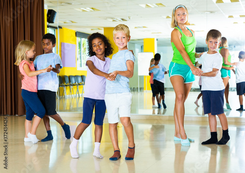 Little boys and girls dancing pair dance in the ballet studio. High quality photo