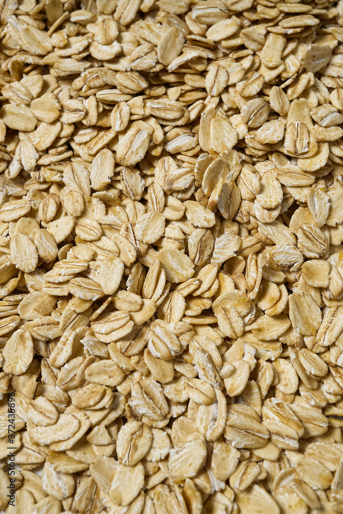 organic healthy pile of dry oat flakes, texture background. organic healthy pile of dry oat flakes, texture background.