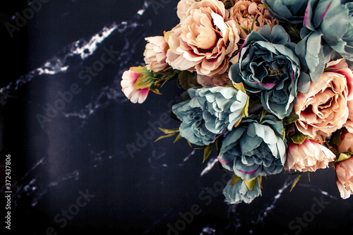 Fototapeta Naklejka Na Ścianę i Meble -  cream and blue peonies on dark marble