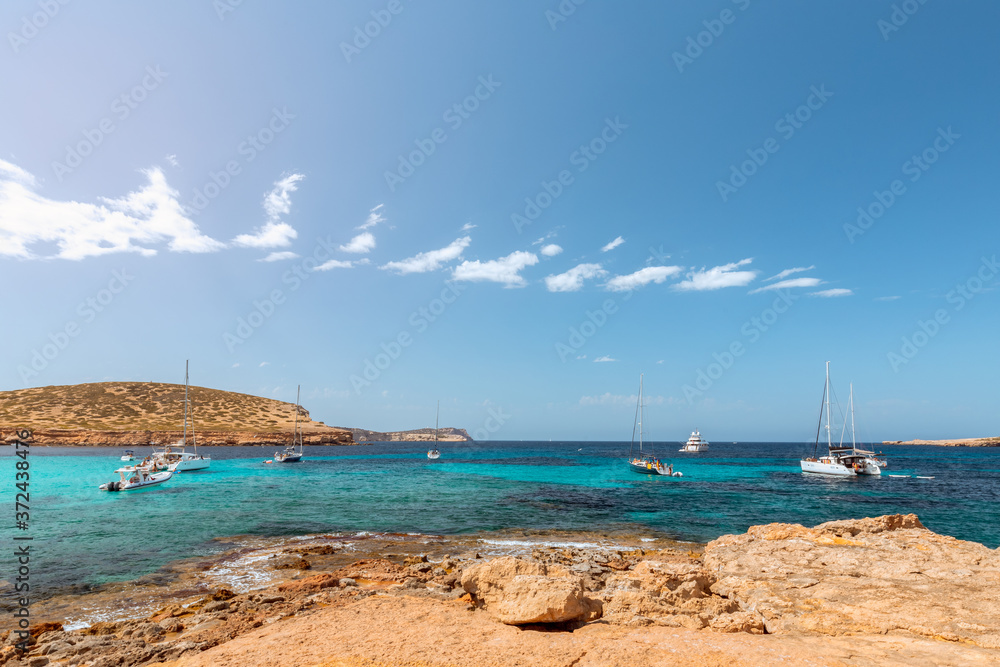Rocky coast and the purest sea water of the Ibiza island. Balearic Islands, Spain