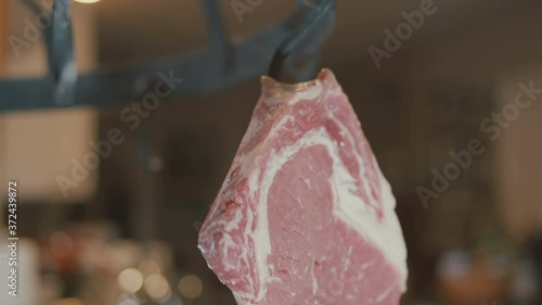 meat hanging from meat hook