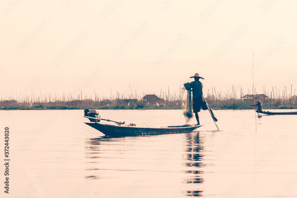 Intha traditional leg rowing fisherman on Inle lake, Burma, Myanmar