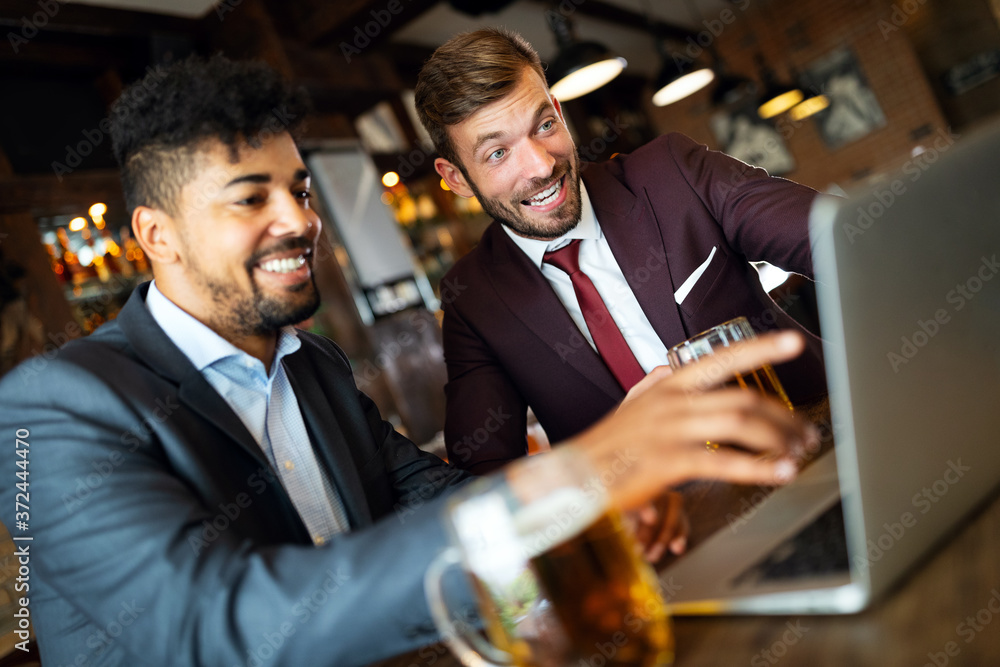Business people drink beer after work. Businessmen enjoy a beer. Business people drink beer after work. Businessmen enjoy a beer.