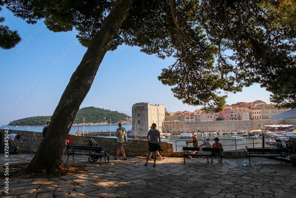 Tourists viewing the harbour and old town in Dubrovnik, Croatia