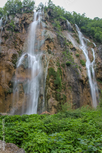 A long exposure of a large waterfall flowing at Plitvice Lakes, Croatia