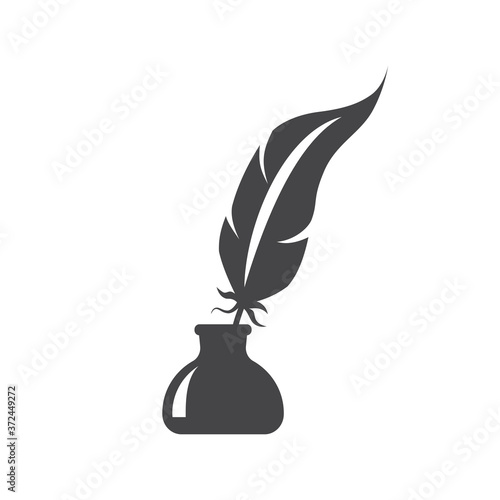 Pen feather in ink bottle black vector icon. Inkstand or ink well with bird feather glyph silhouette symbol.